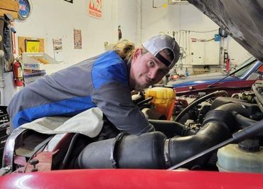 Chris Mentzer working over an engine bay
