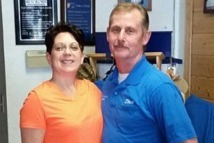 Dave and Char Gibson standing together inside the shop